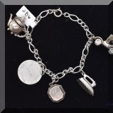 J086. Sterling silver Danecraft charm bracelet. 7” - $42